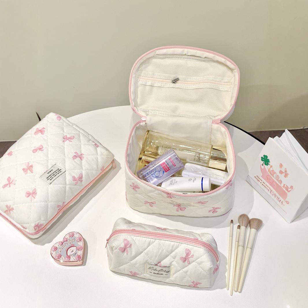Simple bow travel portable cosmetic bag large capacity high-end feeling ins high-value cosmetic bag a batch