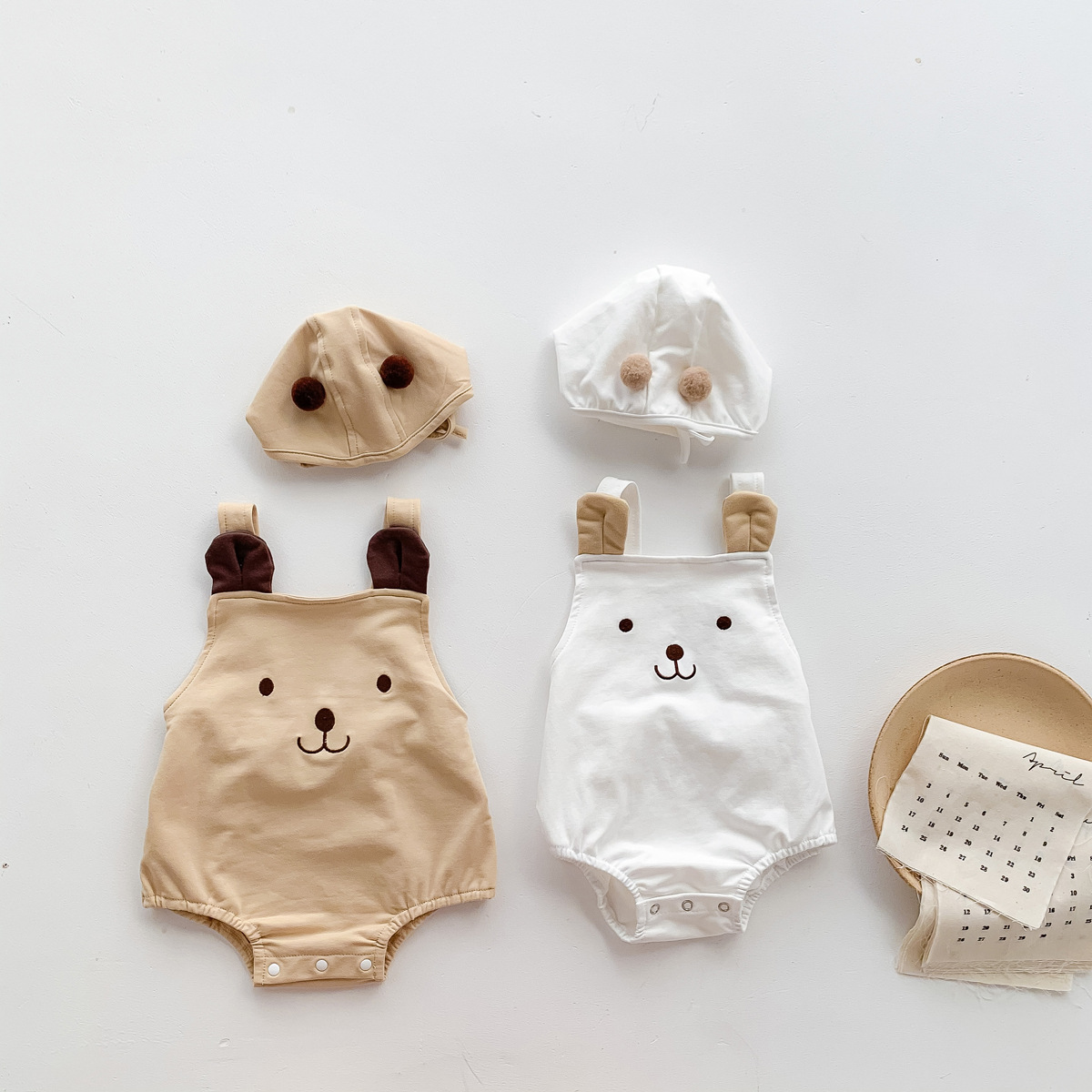 Picture of 2025 Baby Clothes Summer Cute Bear Sleeveless Sling Bag Fart Clothes for Boys and Girls, Two Sets of Hats