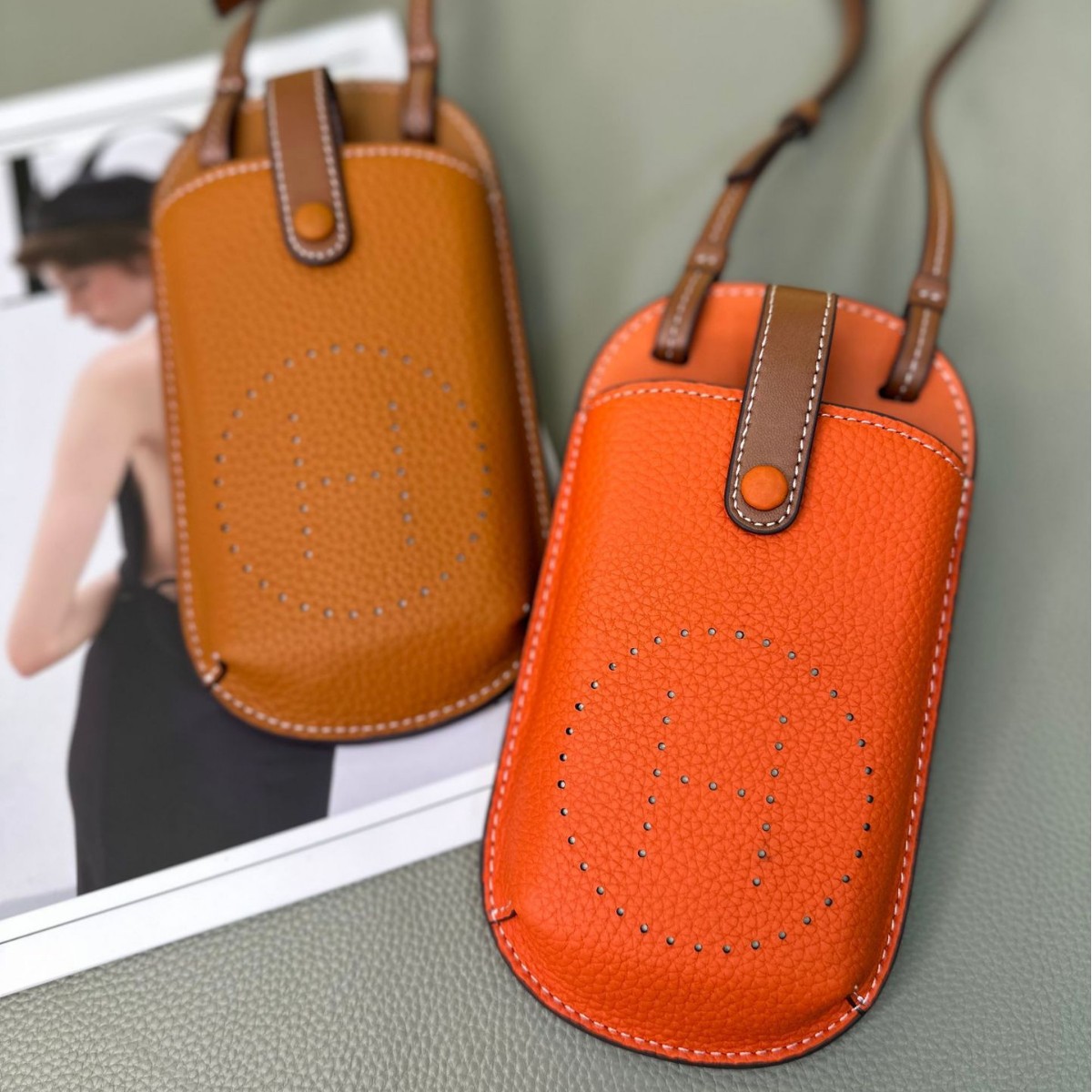 Picture of Cowhide Hollow Mobile Phone Bag for Women 2024 New Fashion Super Hot Shoulder Crossbody Bag Niche Design Western Style Large Capacity