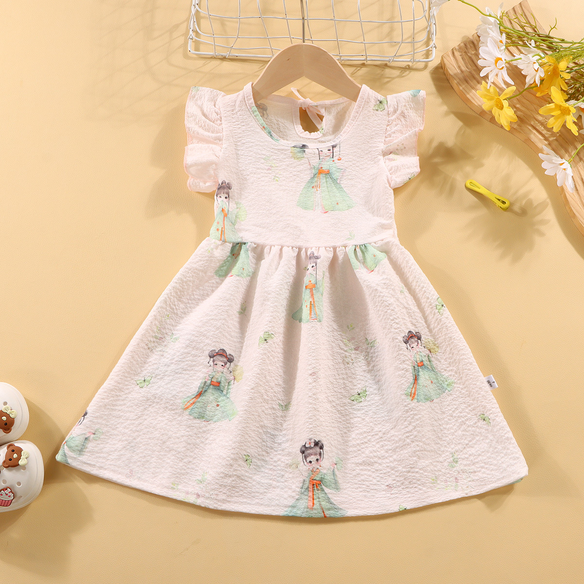 Picture of Girls' short-sleeved T-shirt 2024 new summer baby girls' off-shoulder strap fashionable western style top for infants and children