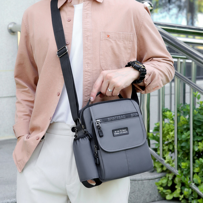 Picture of New Shoulder Bag Men's Oxford Cloth Crossbody Bag Men's Business Casual Outdoor Vertical Handheld Small Bag Men's Water Cup Bag