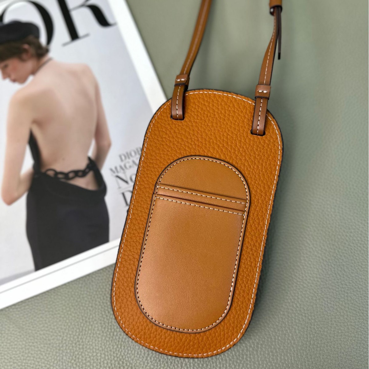 Picture of Cowhide Hollow Mobile Phone Bag for Women 2024 New Fashion Super Hot Shoulder Crossbody Bag Niche Design Western Style Large Capacity