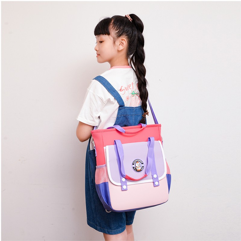 Picture of New track children's schoolbag 2024 new 1-6 grade three tutorial bag tutorial bag portable shoulder double shoulder