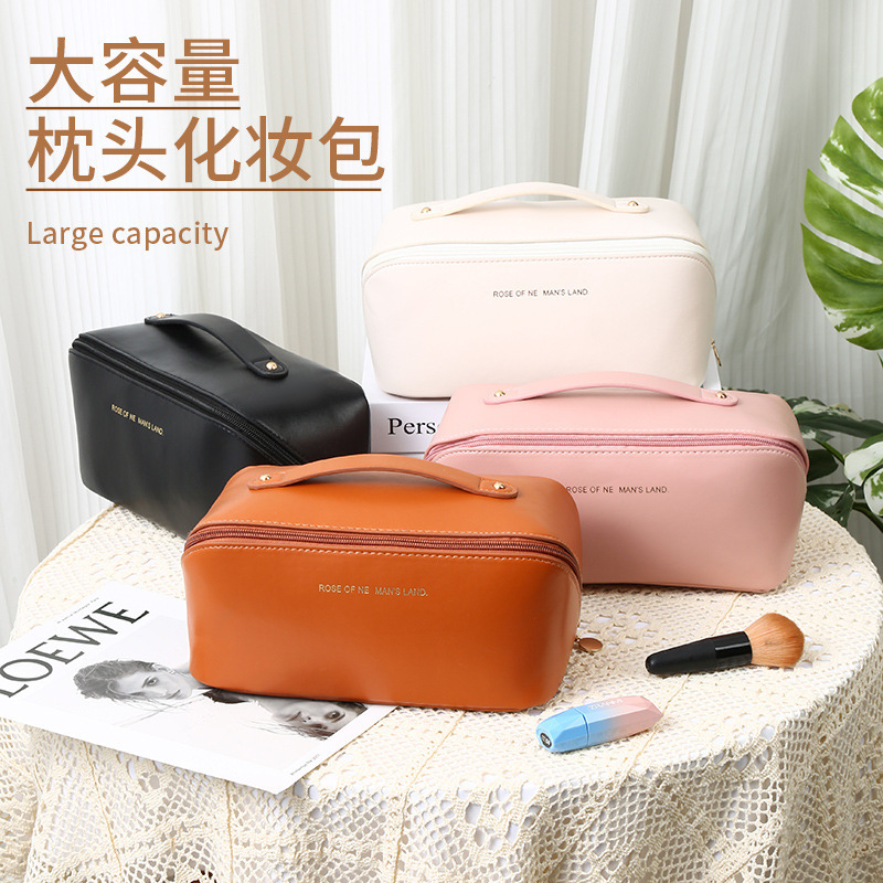 Hot selling PU portable pillow cosmetic bag high value ins style large capacity cosmetic brush storage bag Amazon in stock