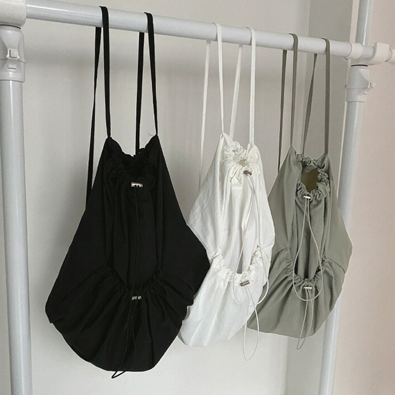 South Korea casual nylon large capacity student backpack simple Joker drawstring solid color canvas backpack wholesale