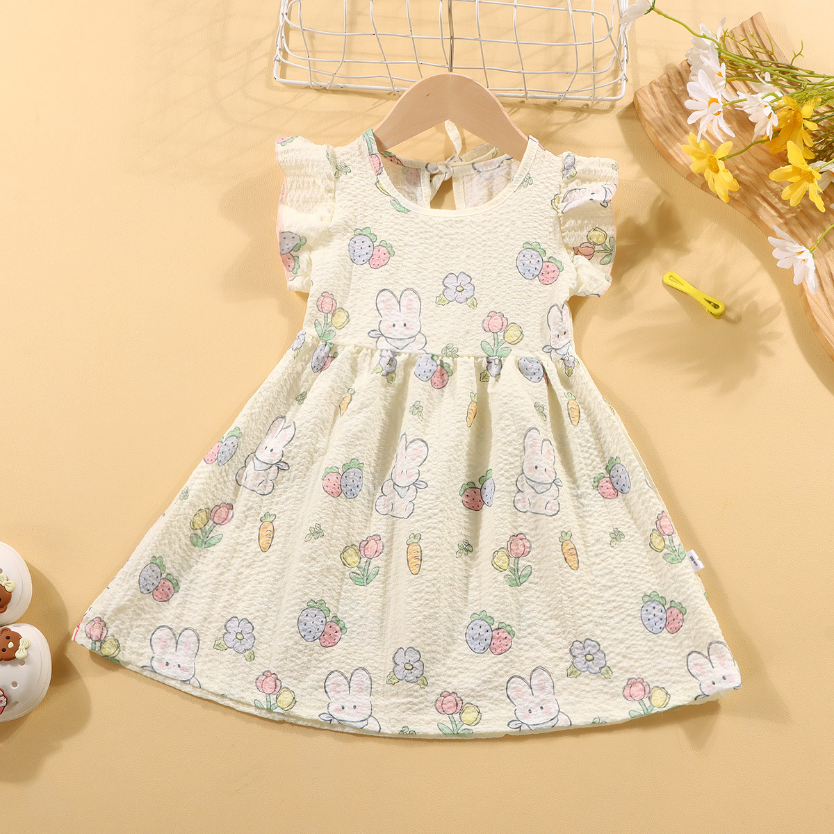 Picture of Girls' short-sleeved T-shirt 2024 new summer baby girls' off-shoulder strap fashionable western style top for infants and children