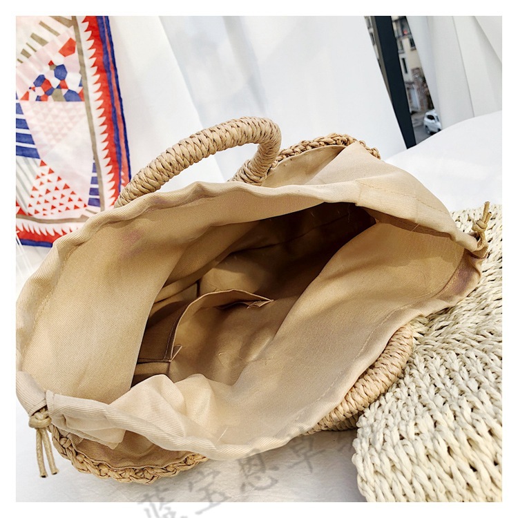 Picture of New semi-circular moon handbag hand-woven beach bag solid color all-match portable women's straw bag