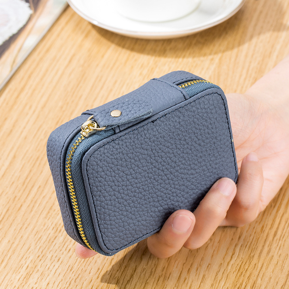 Picture of 2024 Genuine Leather Mini Portable Lipstick Bag with Mirror First Layer Cowhide Storage Bag Coin Coin Headphone Bag for Women
