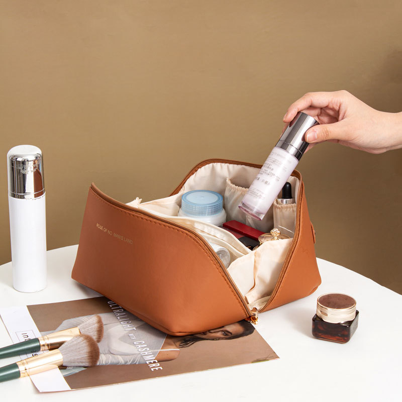 Picture of Ins Portable Large Capacity PU Portable Toiletry Bag Travel Partition Storage Bag Organ Pillow Cosmetic Bag Wholesale