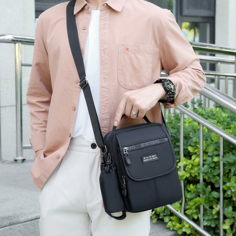 Picture of New Shoulder Bag Men's Oxford Cloth Crossbody Bag Men's Business Casual Outdoor Vertical Handheld Small Bag Men's Water Cup Bag
