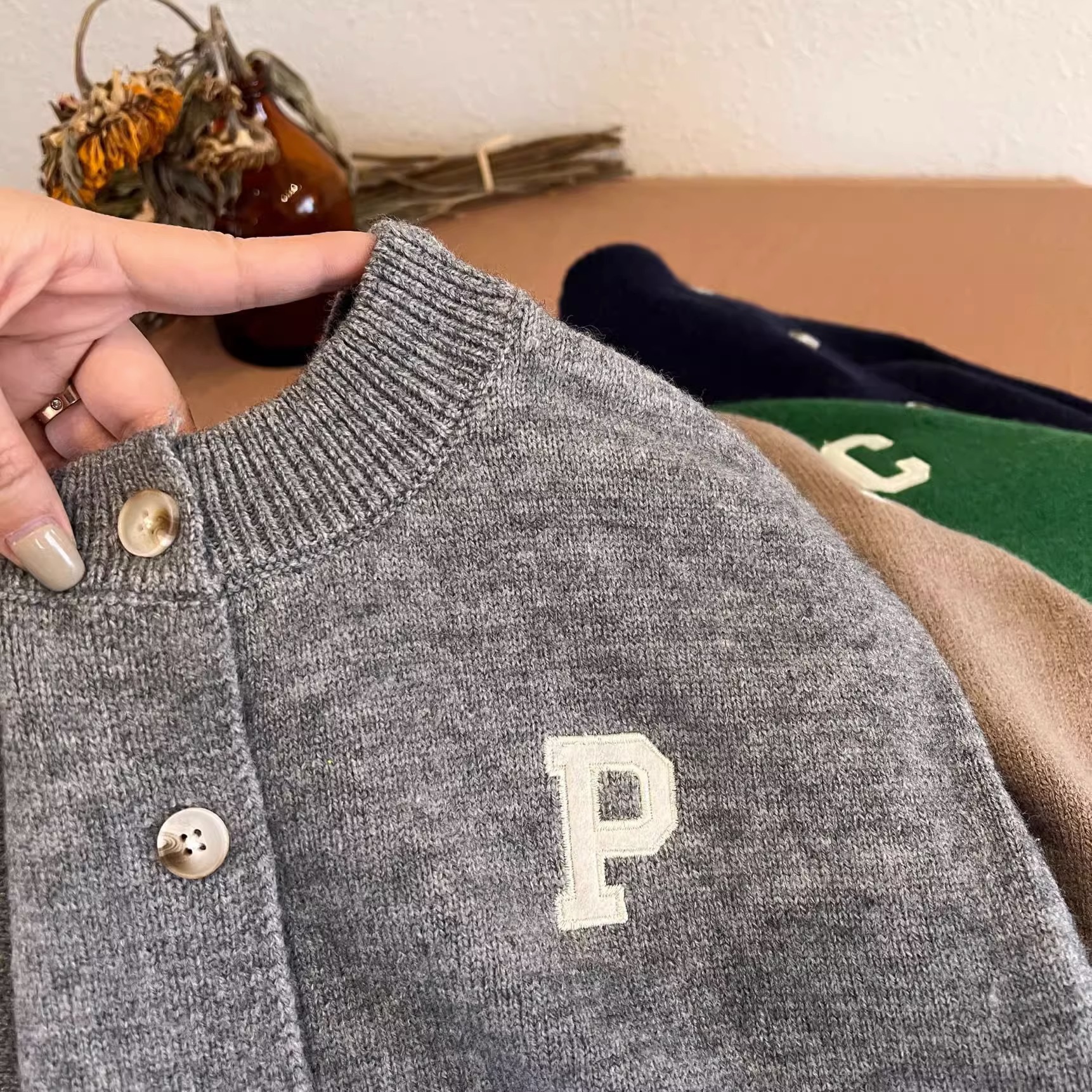 Picture of Trendy children's sweater 2023 spring new boys and girls round neck solid color letter wool cardigan baby casual coat