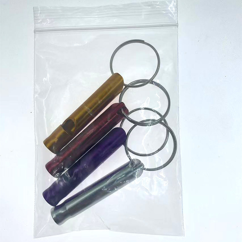Picture of Outdoor aluminum alloy survival whistle wholesale portable key chain referee whistle high frequency emergency fire training survival whistle