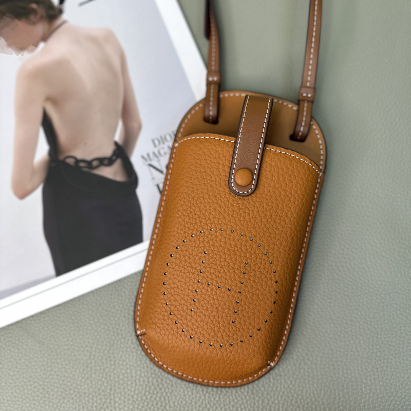 Picture of Cowhide Hollow Mobile Phone Bag for Women 2024 New Fashion Super Hot Shoulder Crossbody Bag Niche Design Western Style Large Capacity
