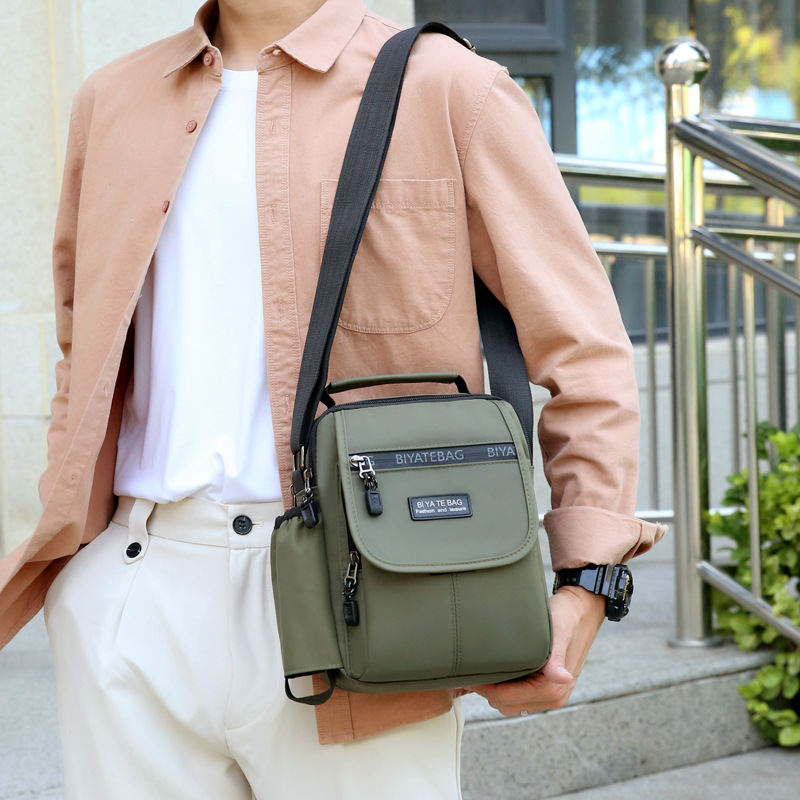 Picture of New Shoulder Bag Men's Oxford Cloth Crossbody Bag Men's Business Casual Outdoor Vertical Handheld Small Bag Men's Water Cup Bag
